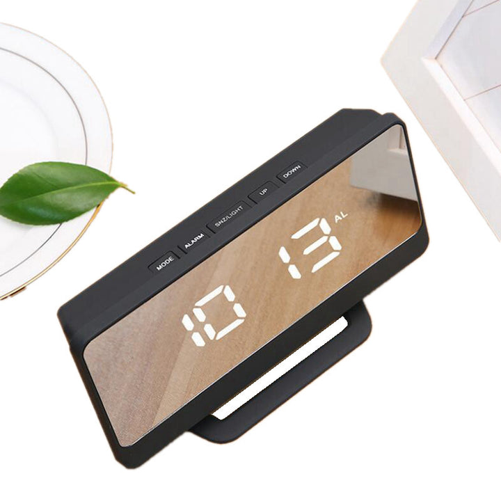 Digital alarm clock with mirror display and snooze function