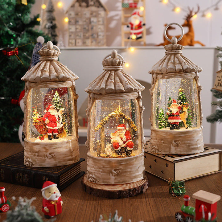 Illuminated Christmas lantern with snow scenes