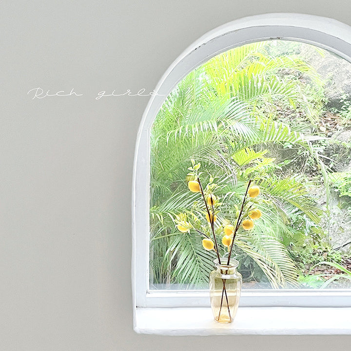 Decorative branch with artificial lemons