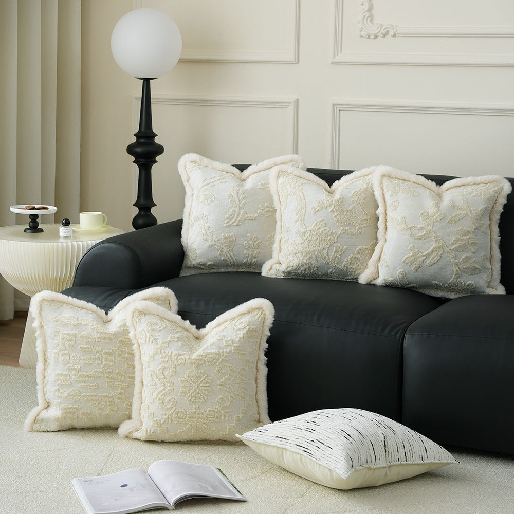Square decorative pillow with embossed circular relief and soft faux fur edging