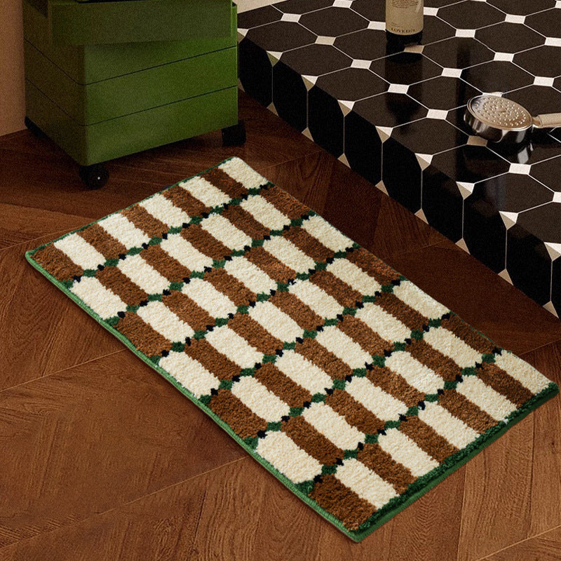 Hand-tufted bathroom mat with a velvety pile, non-slip latex backing, and geometric honeycomb check pattern