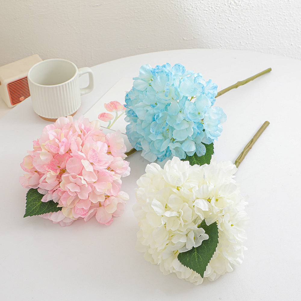 Artificial flower branch with realistic flowers