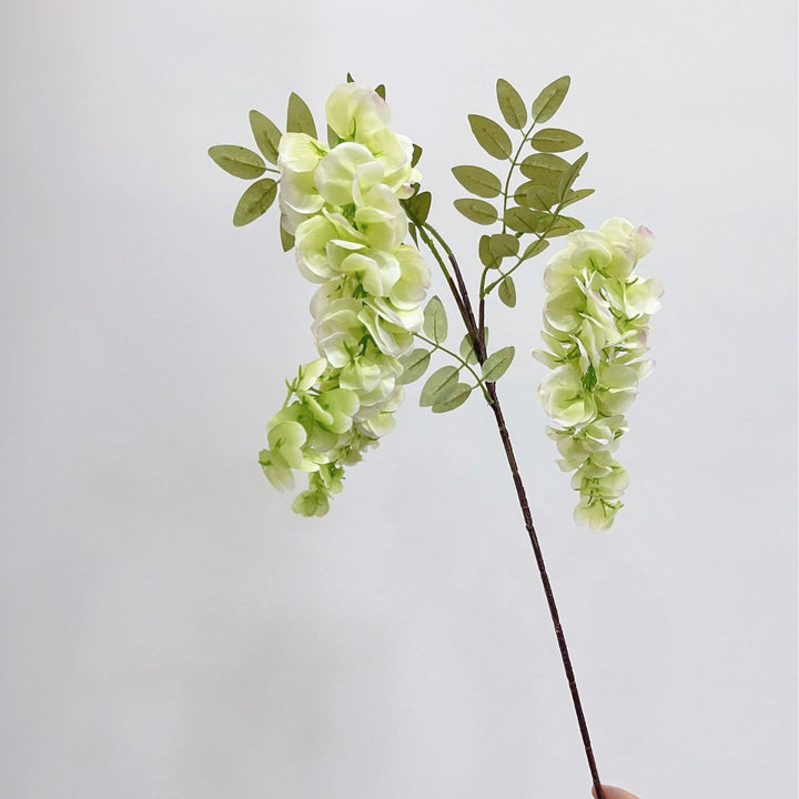Artificial flower branch with lifelike, hanging flowers