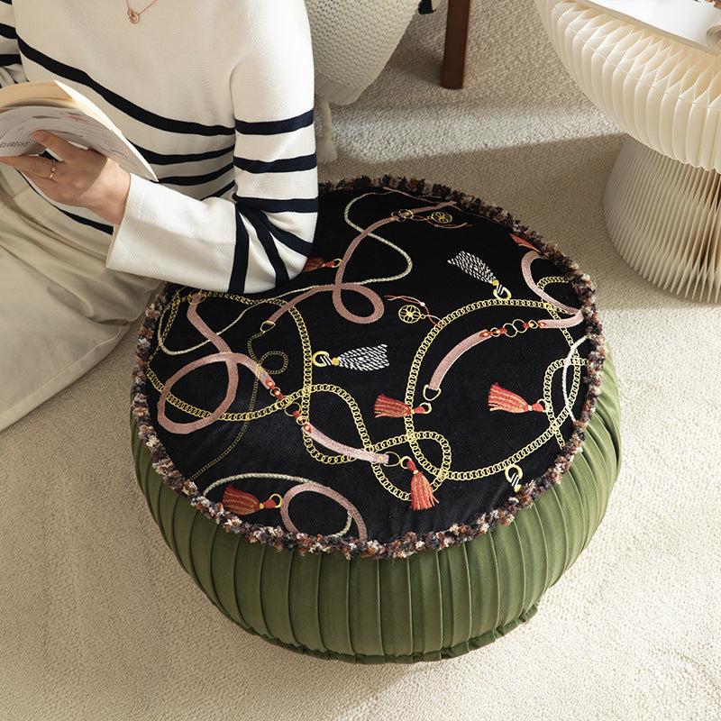 Round decorative floor cushion pouf with velvety printed top, pleated side wall, and fringe edge