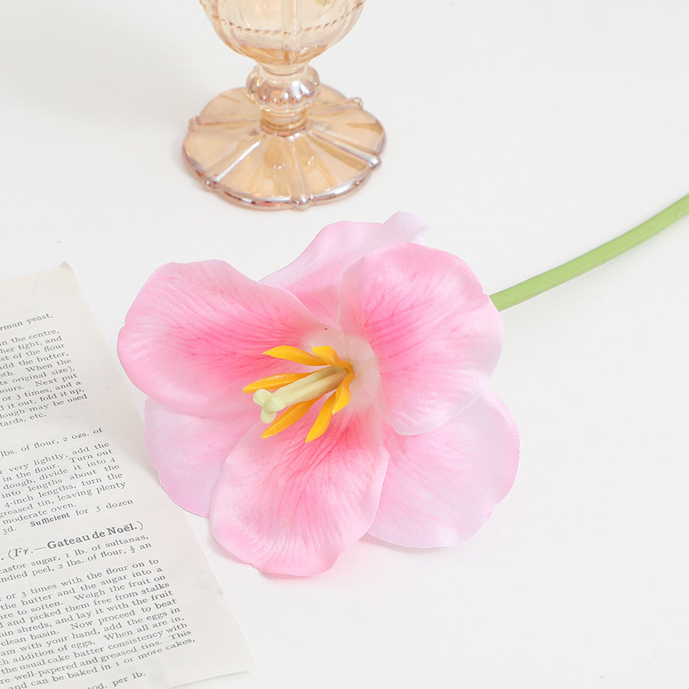 Artificial orchid flower branch with intricately detailed flowers