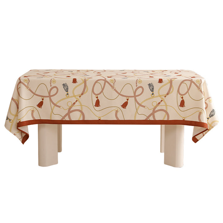 Rectangular decorative tablecloth with cord and tassel pattern as well as contrasted hem edge