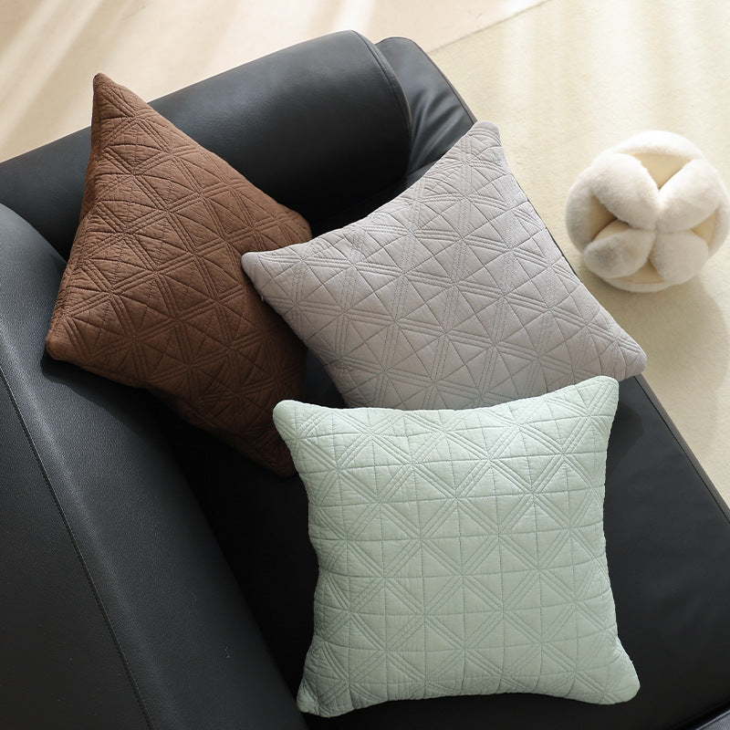 Square quilted decorative cushion made of cotton blend fabric with geometric cross quilted pattern