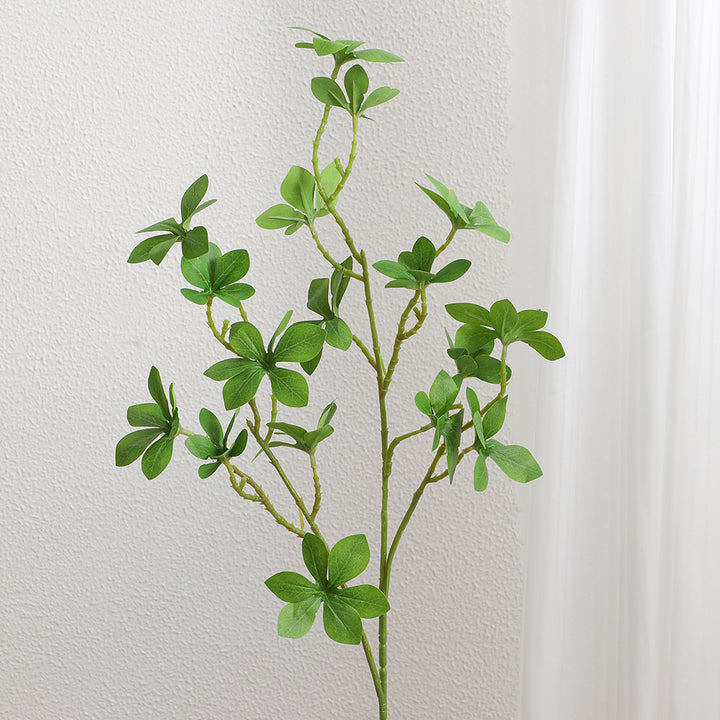 Decorative artificial branch with vibrant leaves