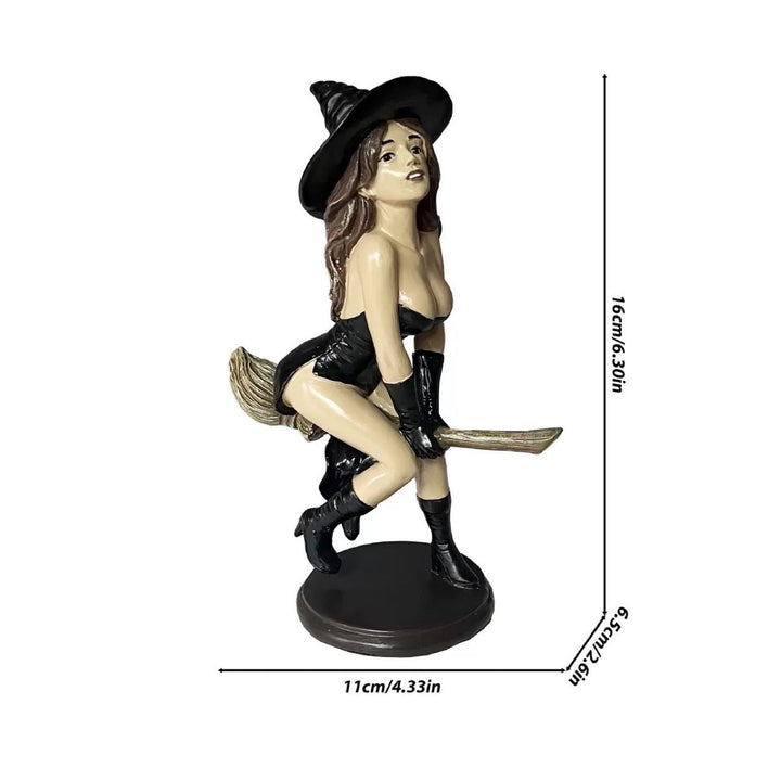 Decorative witch figure with broom