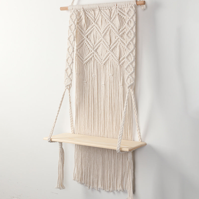 Macramé wall shelf with integrated plant holder
