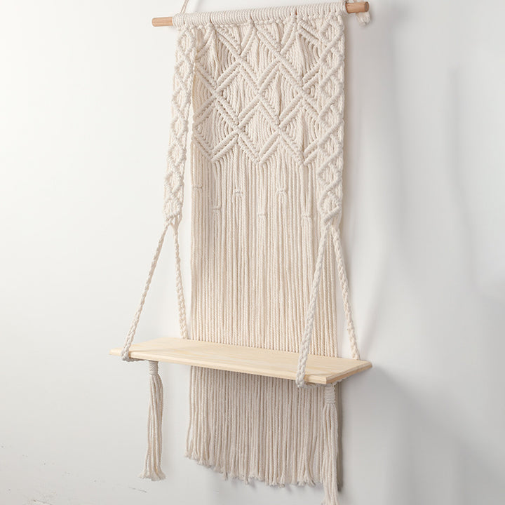 Macramé wall shelf with integrated plant holder