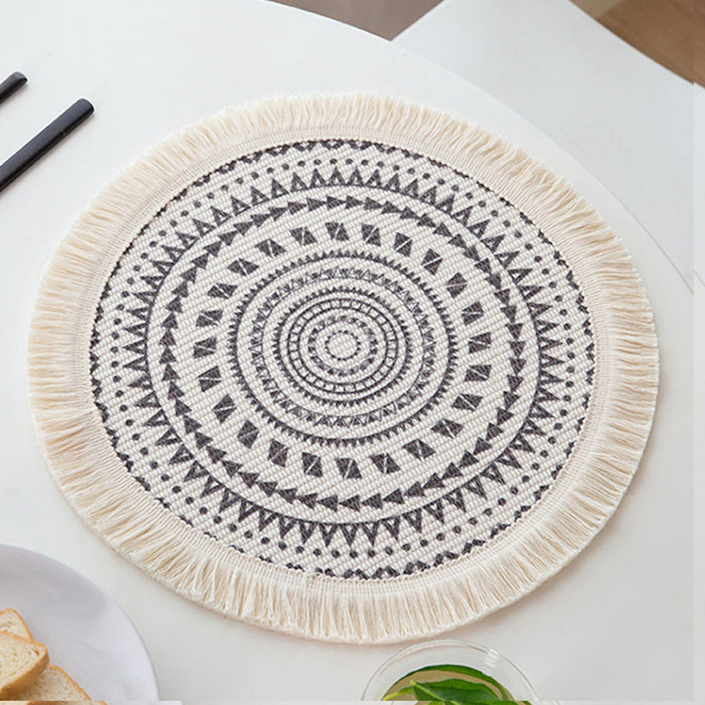 Round woven placemat with fringes and mandala jacquard structure