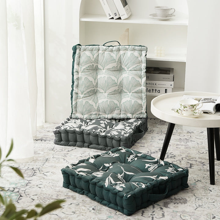 Padded chair cushion with carrying handle and decorative stitching