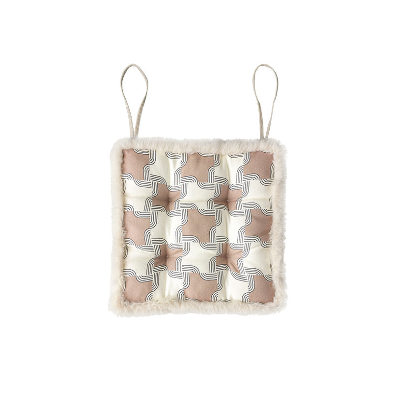Padded seat cushion with fastening straps, quilted tufting surface and faux fur trim
