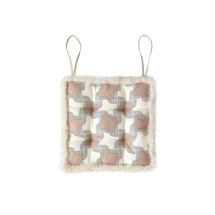 Padded seat cushion with fastening straps, quilted tufting surface and faux fur trim