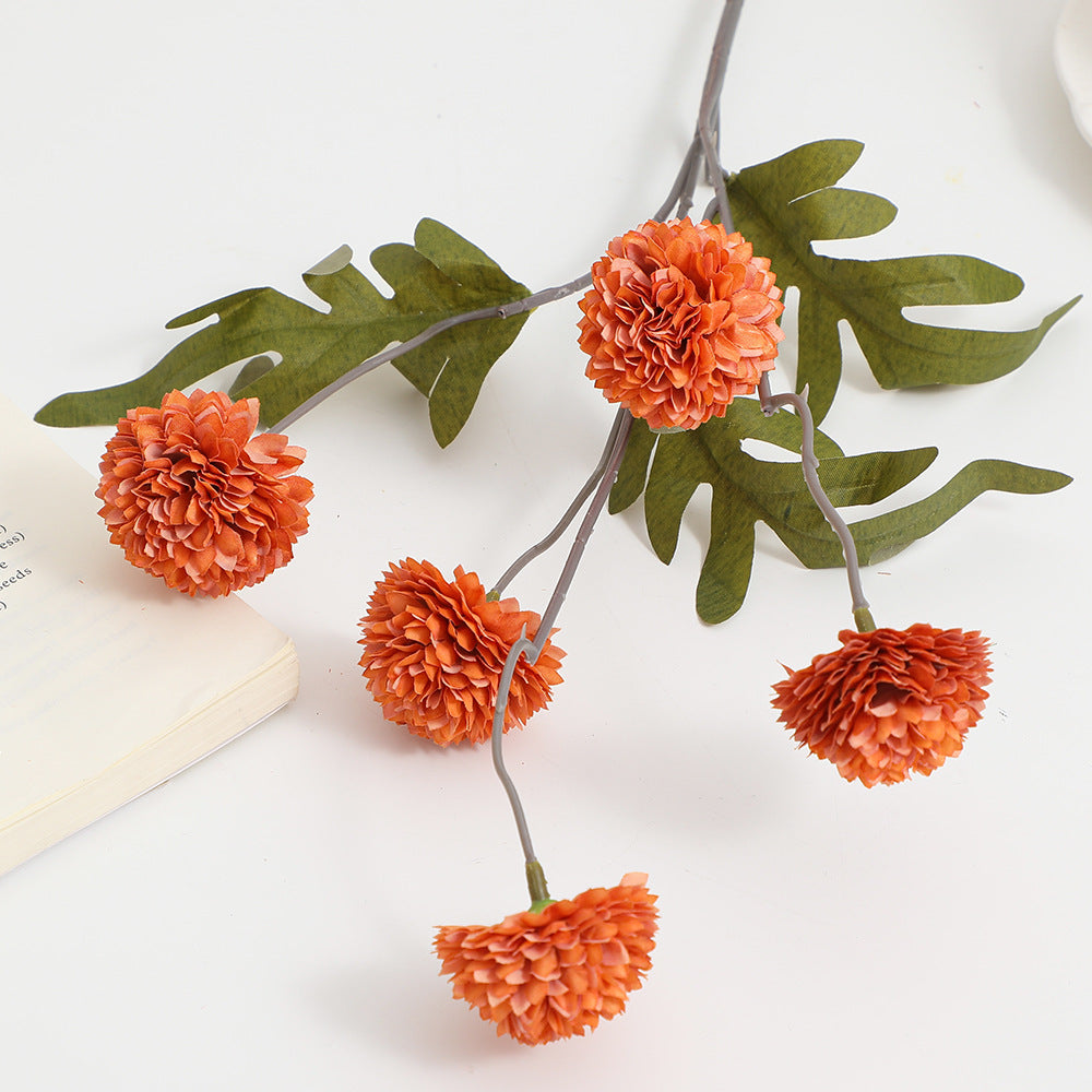 Artificial flower branch with intricate flowers