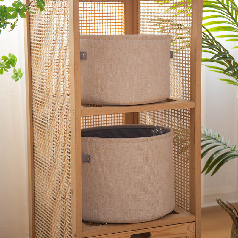 Organizer basket with practical handle and water-repellent inner coating