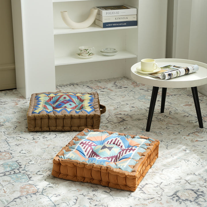 Padded seat and floor cushion with carrying handle and graphic ethno pattern