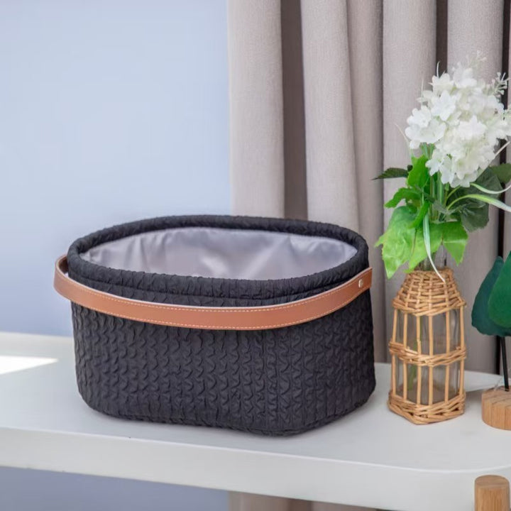 Elegant storage basket with faux leather handle