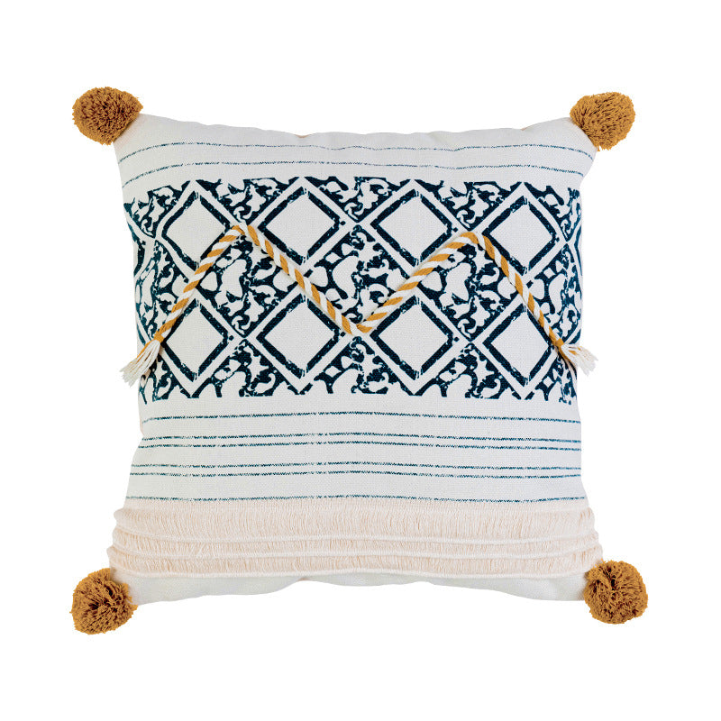 Woven decorative cushion cover in ethnic mix with braided ribbon and tassels