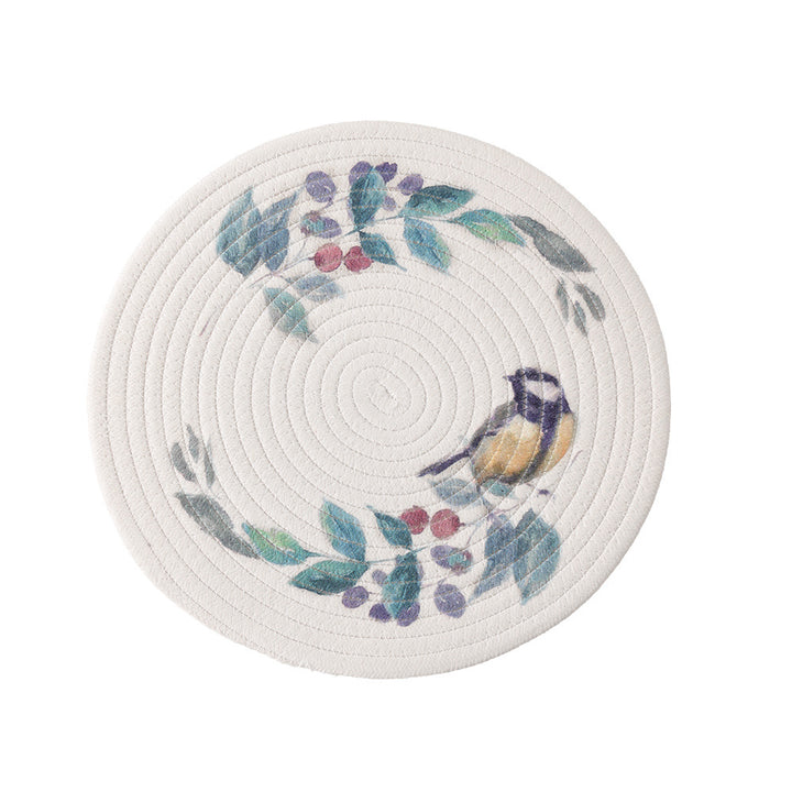 Round placemat made of woven cotton with a cute rhinoceros illustration and floral wreath
