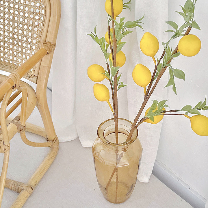Decorative branch with artificial lemons