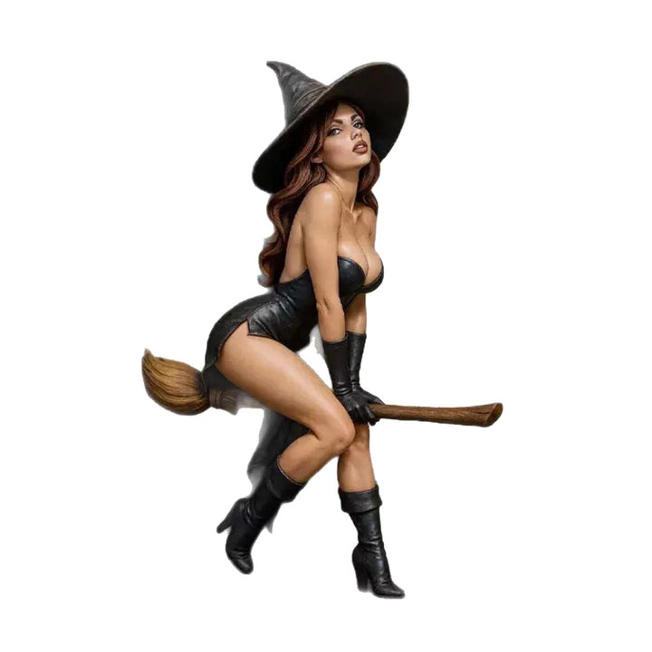Decorative witch figure with broom