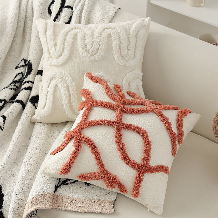 Geometric tufted sofa cushion with textured loop appliqué and removable cover
