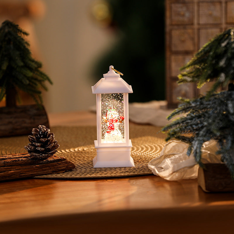 Illuminated Christmas lantern with glittering snowman scene