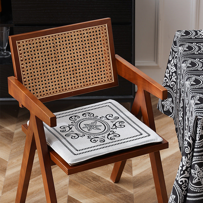 Double-sided seat cushion with ties and decorative jacquard pattern