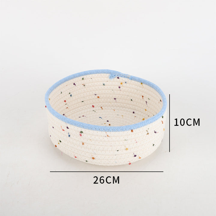 Storage basket made of natural cotton fabric with colorful dots