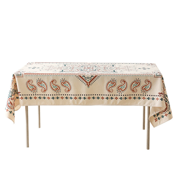 Water-repellent rectangular tablecloth with paisley pattern and coated cotton look