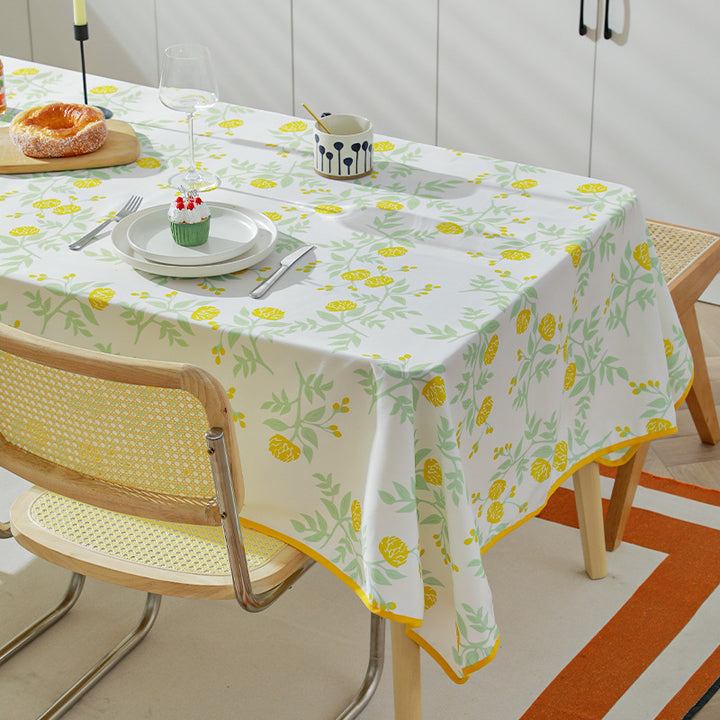 Rectangular washable cotton-polyester tablecloth with contrasted decorative edge and botanical print