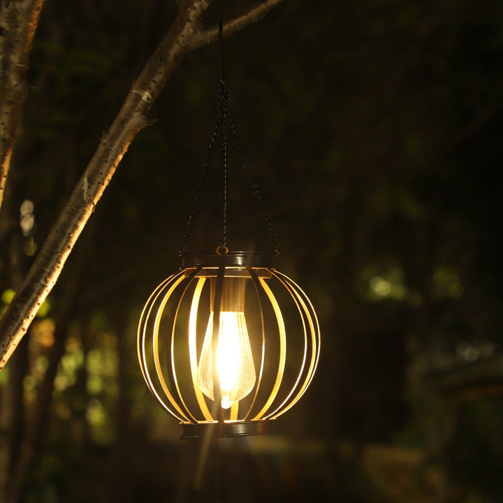 Weatherproof hanging solar LED lanterns for outdoor use with metal cage, warm glass, and hanging chain