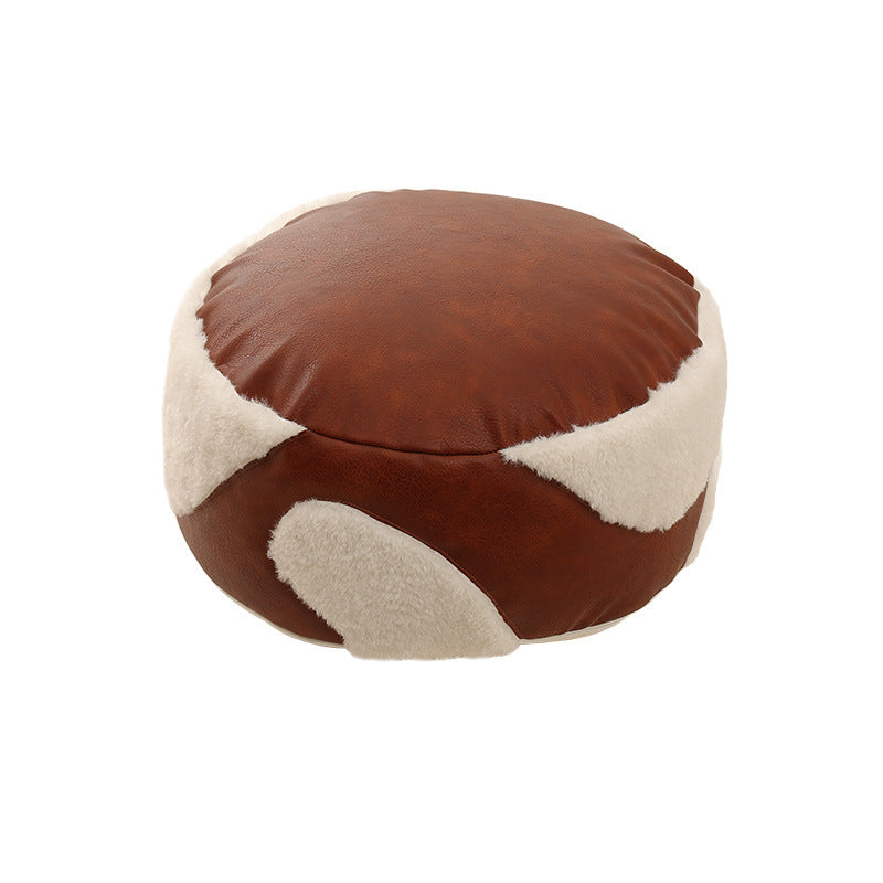 Round padded seat pouf as a floor stool with vintage leather look and teddy fleece inserts