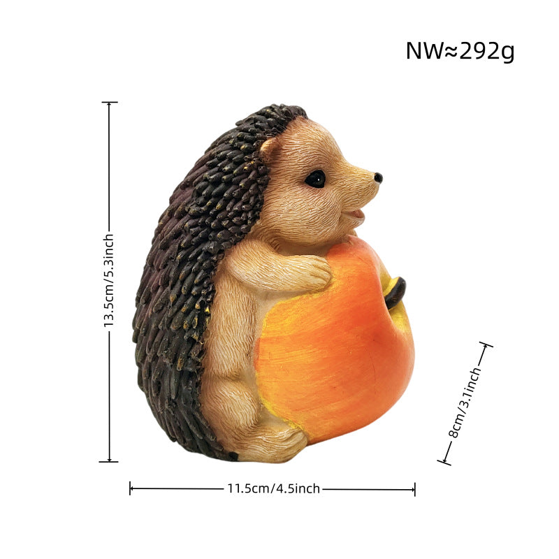 Cute hedgehog sculpture with fruit