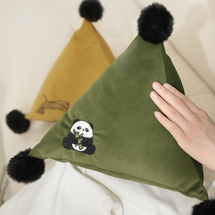 Triangular decorative pillow with zebra embroidery, pompom applications, and soft velvet cover