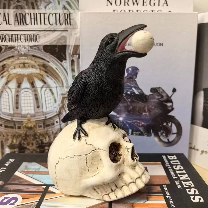 Decorative figure with raven on skull