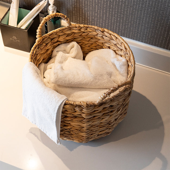 Handwoven decorative basket with heart motif