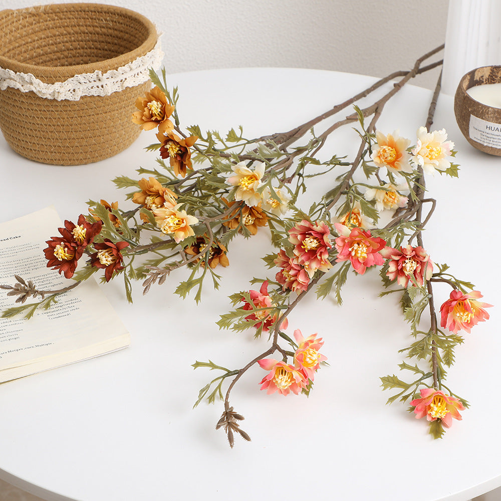 Elegant artificial flower branch with detail-loving blossoms