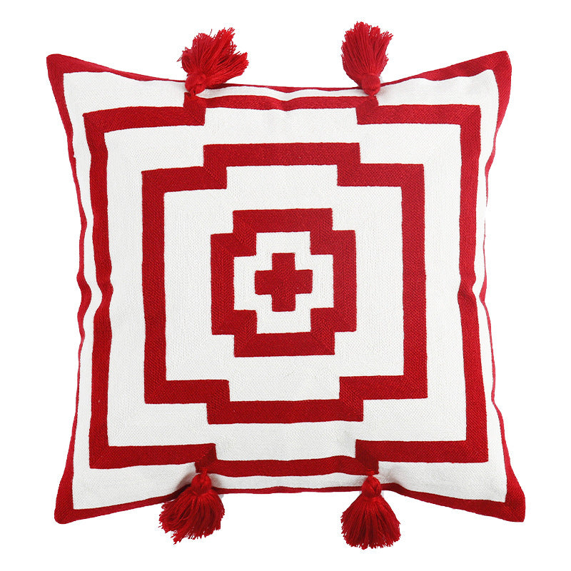 Square cushion cover in graphic geometric relief with decorative tassels