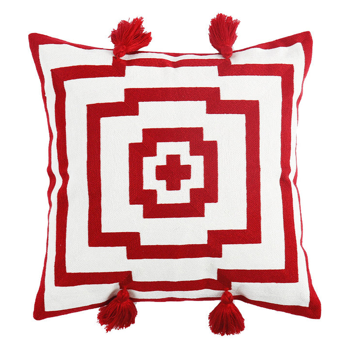 Square cushion cover in graphic geometric relief with decorative tassels