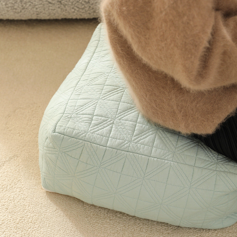 Padded floor seat pouf made of quilted cotton blend