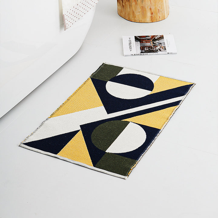 Modern geometric bathroom rug made of flat-woven cotton with non-slip backing