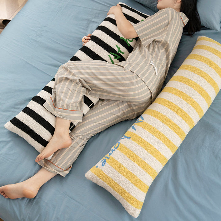 Elongated bench and windowsill cushion with nautical stripe texture and embroidered lettering