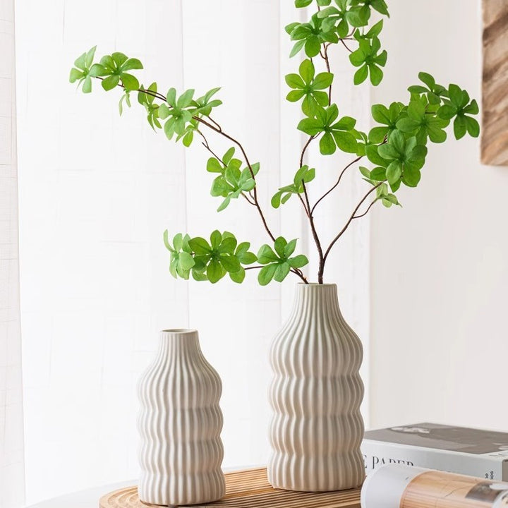 Stylish ceramic vase with wave structure