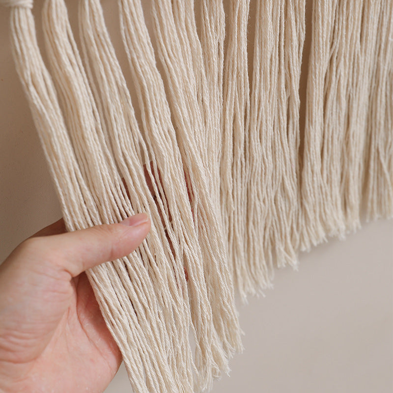 Woven wall hanging with hand-knotted fringes and bunny motif