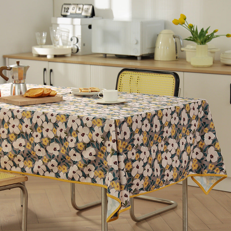 Coated tablecloth in country house style with botanical print and fine hem