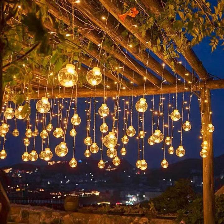 Hanging star and crescent moon LED curtain string lights for bedroom ambiance
