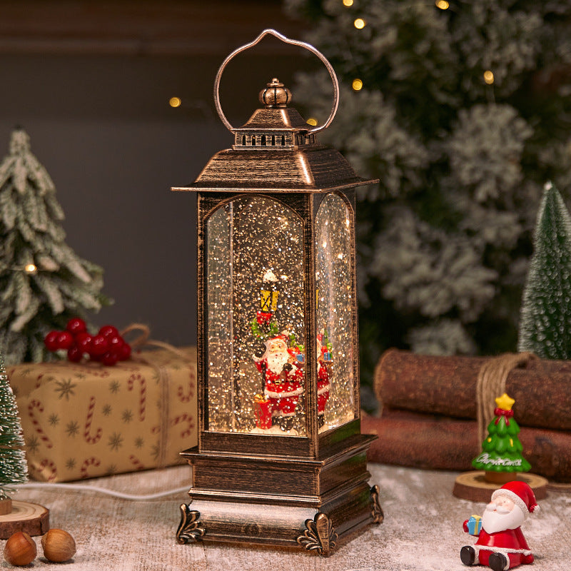 Illuminated Christmas lantern with snow and Christmas motif